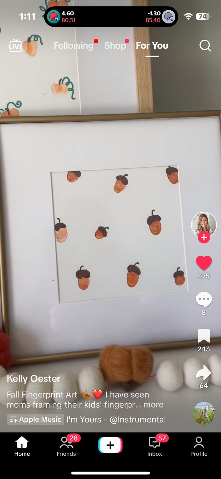 an orange cat is sitting in front of a white frame with stickers on it