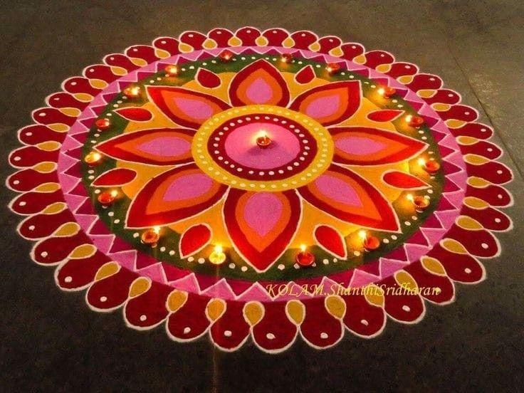 a decorated table with candles on it in the shape of a flower and leaves design