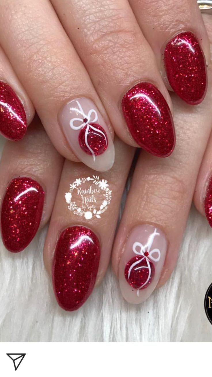 red and white nail polish with bows on the top, and glitters on the bottom