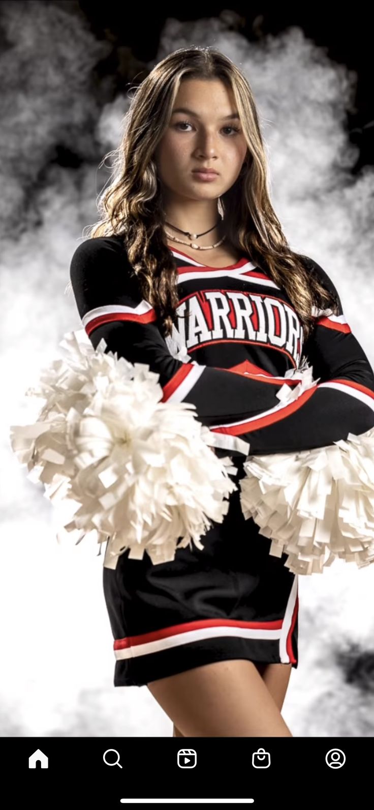 a beautiful young woman in a cheer uniform