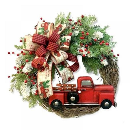 a wreath with a red truck tied to it