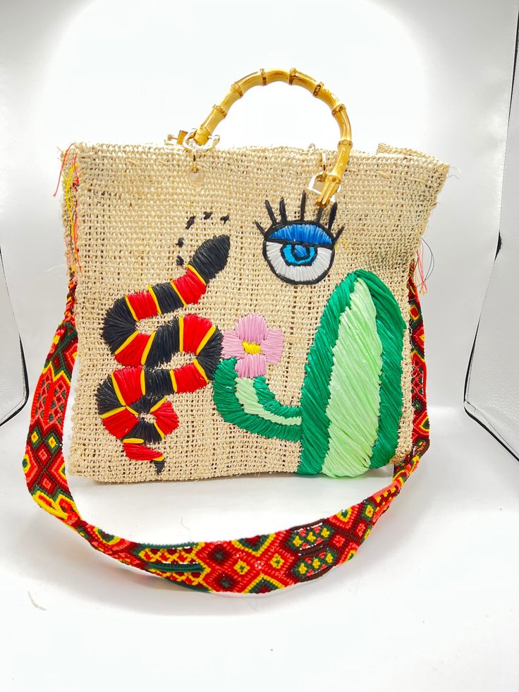 The perfect unique gift for that special person Handmade of henequen and beautifully embellished by artisans in Mexico these bags are a must have for the summer or any occasion . We have different syle of color bags which you can choose. Small bag dimensions  Material: Henequen. Height: 9.5 inches Width: 12 inches Depth: 5 inches Strap 120cm Medium bag dimensions Material: Henequen. Height: 12 inches Width: 14 inches Depth: 5 inches Strap 120cm embroidered straps to be used as shoulder or crossbody. variation on color of staps and bag. Chic Multicolor Embroidered Bag, Multicolor Embroidered Vacation Bag, Luxury Embroidered Multicolor Bags, Luxury Bohemian Bag With Multicolor Embroidery, Luxury Bohemian Multicolor Embroidery Shoulder Bag, Embroidered Bag, Special Person, Medium Bags, Small Bag