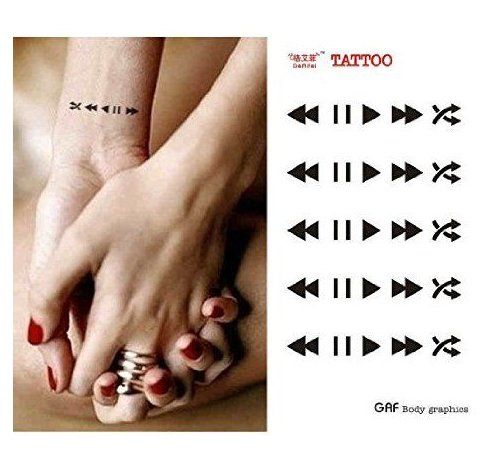 a woman's foot with arrows on it and the words tattoo written in different languages