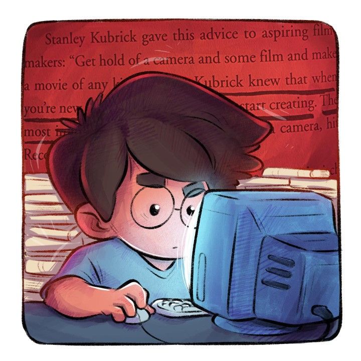 a boy is looking at a computer screen