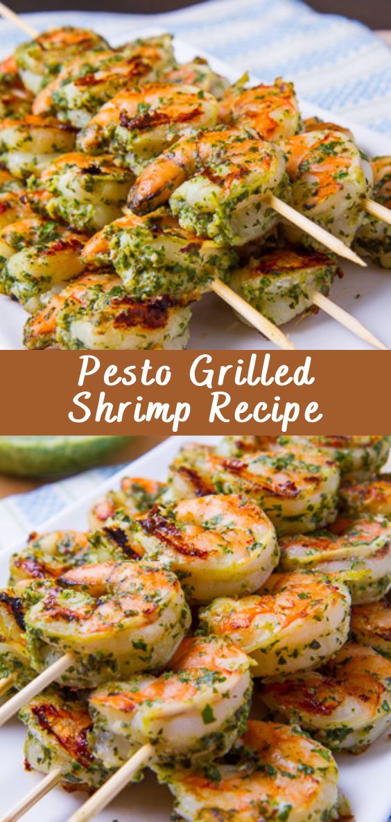 grilled shrimp skewers with pesto sauce on top and green chili in the middle