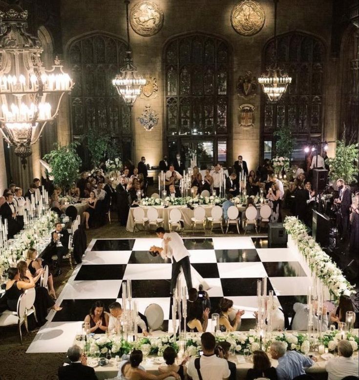 a large checkered floor is set up for a formal dinner