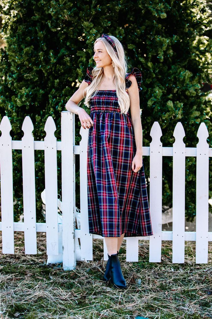 The Lucky Knot Exclusive Dress - we created this plaid tartan beauty for all of your fall and winter occasions! With elastic smocking, gorgeous ruffle shoulders, a peek-a-boo back cutout and A-line midi silhouette, you will want to wear this to every single upcoming event Casual Plaid Dress With Ruffles, Plaid Dresses For Fall Holiday, Casual Gingham Plaid Dress For Fall, Winter Plaid Ruffled Dresses, Casual Plaid Holiday Dress, Fall Gingham Plaid Dress With Ruffles, Casual Plaid Ruffle Dress For Fall, Cotton Plaid Dress For Fall Picnic, Fall Cotton Plaid Dress For Picnic