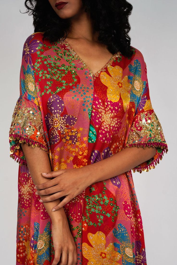 Red floral printed pleated kurta with embellished cuffs and neckline. Comes with printed pant.
Component: 2
Pattern: Print and Embroidery
Type Of Work: Floral print, Beads embroidery
Neckline: V Neck
Sleeve Type: Half sleeves
Fabric: Silk,Raw Silk
Color: Red
Other Details: 
Floral print
Embellished nekcline and sleeves
Occasion: Mehendi and Haldi - Aza Fashions Embroidery Neckline, Kurta Pant Set, Beads Embroidery, Embroidery Floral, Kurta With Pants, Fabric Silk, Red Silk, Pant Set, Raw Silk