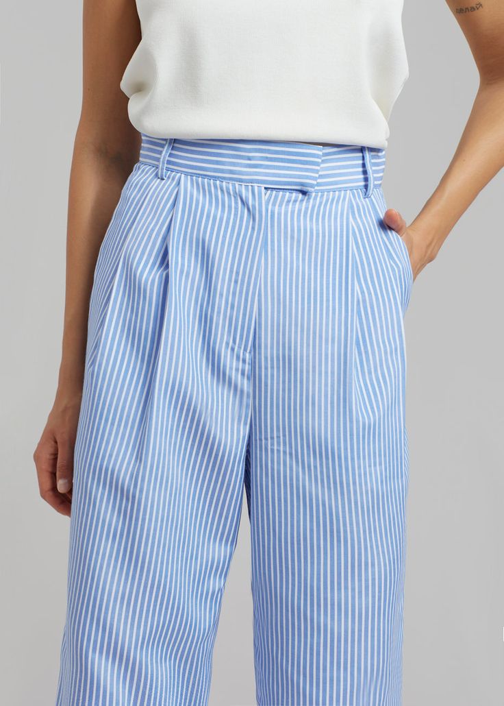 Color: White/Light Blue Midweight cotton fabric Relaxed straight leg silhouette Pleat front detail Pressed crease Slant hip pockets Hook and bar closure Belt loops 100% Cotton Dry Clean By The Frankie Shop. Imported Product Measurements: XS - 24" Waist, 36" Hip, 16" Rise, 28" Inseam S - 26" Waist, 38" Hip, 16.25" Rise, 28.5" Inseam M - 28" Waist, 40" Hip, 16.5" Rise, 29" Inseam L - 30" Waist, 42" Hip, 17" Rise, 29.25" Inseam XL - 32" Waist, 44" Hip, 17.5" Rise, 29.5" Inseam Model is 174cm/ 5'8" Stripe Suit, The Frankie Shop, Frankie Shop, June 2022, Striped Jeans, Suit Pants, White Light, Straight Leg, Color White