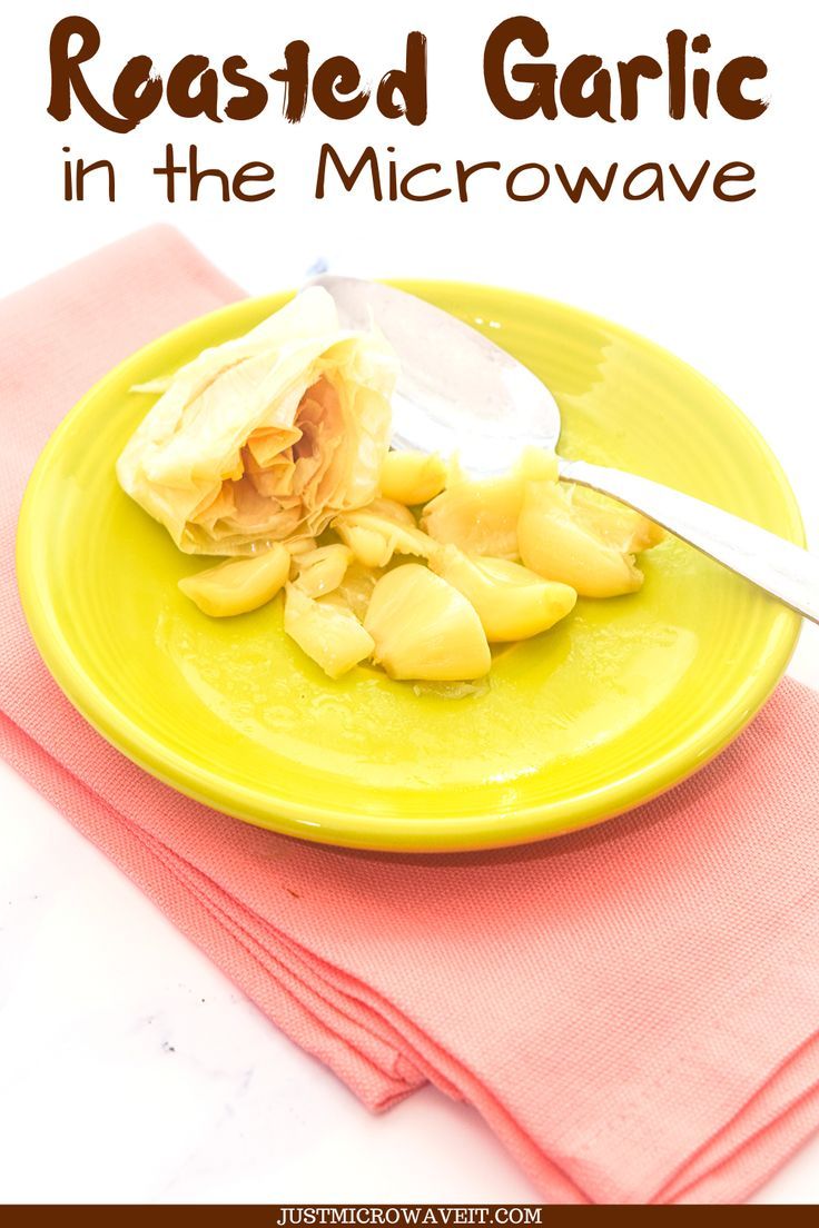 a yellow plate topped with food on top of a pink table cloth next to a knife and fork