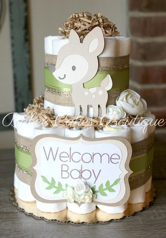 a baby shower cake with a deer on top