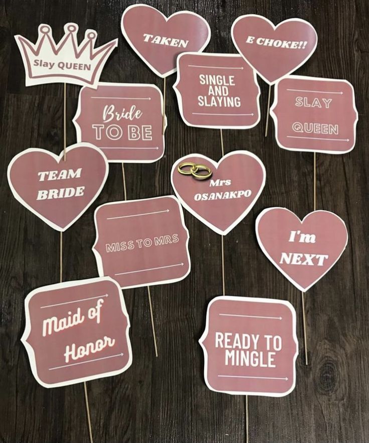 wedding photo props with pink hearts and crowns on them, ready to mingle for the bride