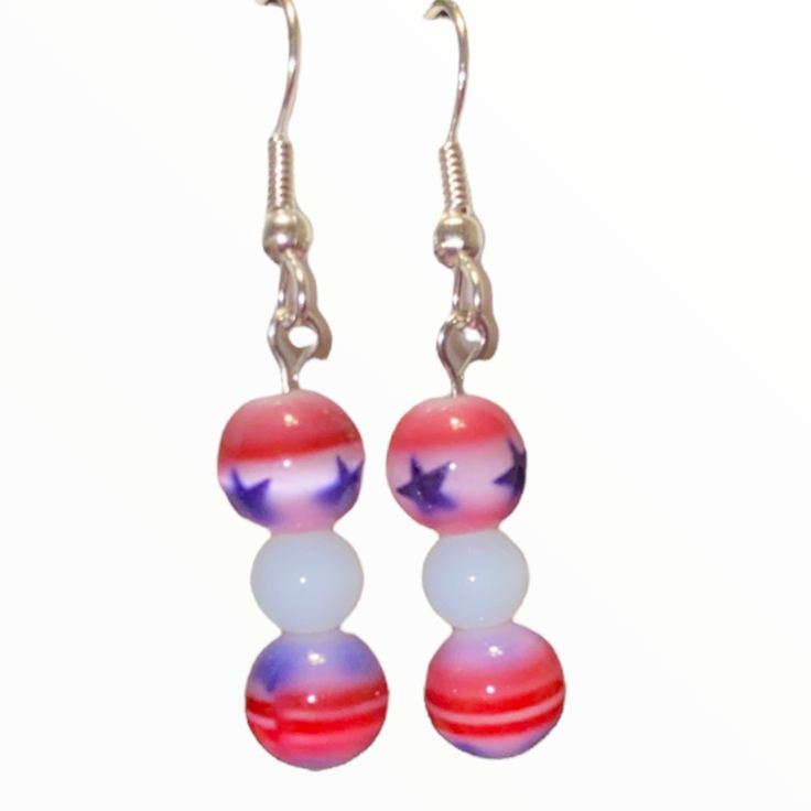 These Hand Crafted Stars And Stripes Earrings Are Essential For Celebrating The Summer Holiday! Red, White & Blue Cat’s Eye Beaded Statement Earrings. White Beads Sit Between Starred And Striped Cat’s Eye Beads. Silver Metal Fish Hook Findings Round, Glass Beads Ideal For Anyone With Pierced Ears. Matching Bracelet Available Separately Perfect For The Birthdays, Anniversaries, 4th Of July, Memorial Day And Other Occasions. Visit My Boutique To Find Other Unique Pieces Of Hand Made Jewelry. Bundl Handmade Blue Patriotic Jewelry, Red Dangle Earrings For 4th Of July, Patriotic Blue Jewelry With Colorful Beads, Patriotic Blue Dangle Jewelry, Blue Patriotic Drop Earrings, Cottagecore Jewelry, Hot Pink Flowers, Metal Fish, Striped Cat