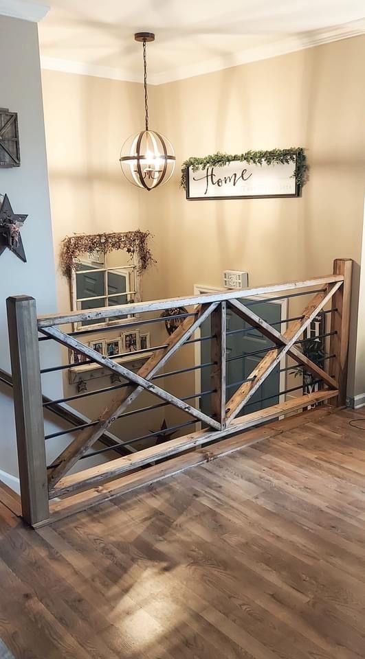 a wooden and metal railing in a home