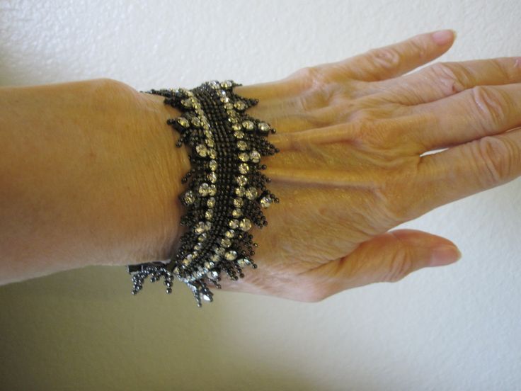 SWAROVSKI STRETCH BRACELET This bracelet is simply elegant! Made of a zillion tiny steel gray beads and gorgeous sparkling prong set rhinestones. 7 inch bracelet with some stretch. It feels like lace fringe. So perfect for any dressy occasion. In excellent vintage condition! Would make a beautiful gift. Elegant Beaded Stretch Bracelet For Parties, Elegant Rhinestone Stretch Bracelet For Party, Elegant Adjustable Stretch Bracelet With Rhinestones, Elegant Adjustable Rhinestone Stretch Bracelet, Elegant Stretch Beaded Bracelets, Character Clothing, Vero Beach Fl, Grey Beads, Vero Beach