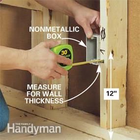 a person using a measuring tape to measure the hole in an unfinished wall with measurements