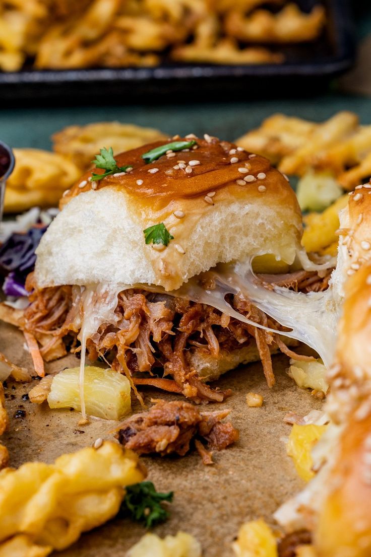 hawaiian pork sliders with pineapple slaw on the side and text overlay