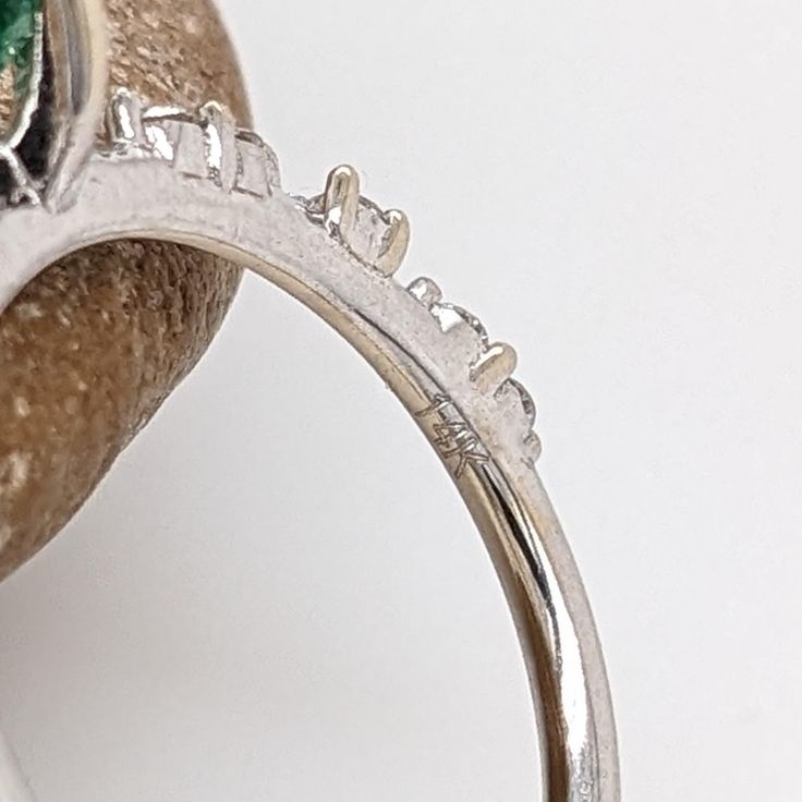 This minimalist 14K white gold setting features an earth-mined emerald with natural earth-mined diamonds. A delicate ring design perfect for an eye-catching engagement or anniversary. This ring also makes a beautiful May birthstone gift for your loved ones! The occasions to show off this ring are endless - mother's Day, graduation, wedding, birthday, date night, Christmas, etc. :) This ring is made with solid 14K Gold and naturally Earth-mined SI / G-H diamonds. Elegant Round Emerald Ring With Half Eternity Band, Elegant Round Emerald Ring With Half Eternity Setting, Elegant Emerald Half Eternity Ring, Diamond Ring With Prong Setting For May Birthstone, Emerald Ring With Center Stone In 14k White Gold, Emerald Diamond Promise Ring, Emerald Ring With Prong Setting In Round Cut, White Gold Diamond Cluster Ring For May Birthstone, May Birthstone Diamond Ring In White Gold