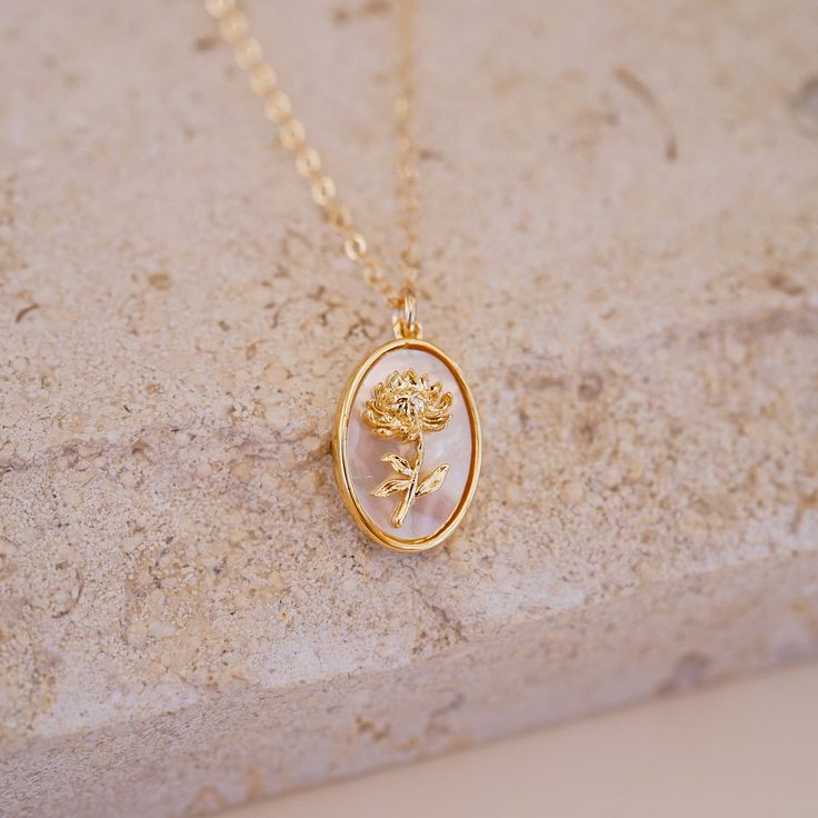 Introducing the November Birth Flower Necklace, a stunning and meaningful addition to our Birth Flower Necklace Collection! This elegant necklace features the delicate Chrysanthemum, the birth flower for November, symbolizing loyalty and friendship. Let the Chrysanthemum inspire you to strengthen your bonds of friendship and loyalty with the people who matter most to you! Whether you're treating yourself or looking for the perfect gift for a loved one, the November Birth Flower Necklace is the p Elegant Flower Charm Necklaces As Gift For Her, Feminine Flower Pendant Necklace As Gift For Her, Feminine Necklace With Flower Pendant As Gift For Her, Feminine Necklace With Flower Pendant For Her, Feminine Flower Pendant Necklace Gift For Her, Elegant Flower Charm Necklace For Mother's Day, Feminine Flower-shaped Necklaces For Gifts, Elegant Birth Flower Pendant Necklace, Feminine Flower Pendant Necklace As A Gift