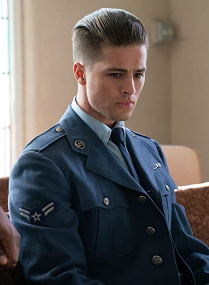 a man in uniform sitting on a couch