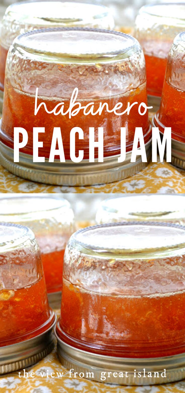 four jars filled with peach jam sitting on top of a yellow and white table cloth