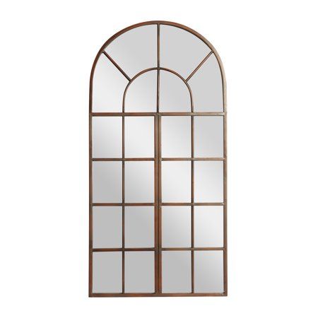 an arched window with glass and metal frame