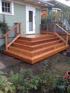 a wooden deck in front of a house