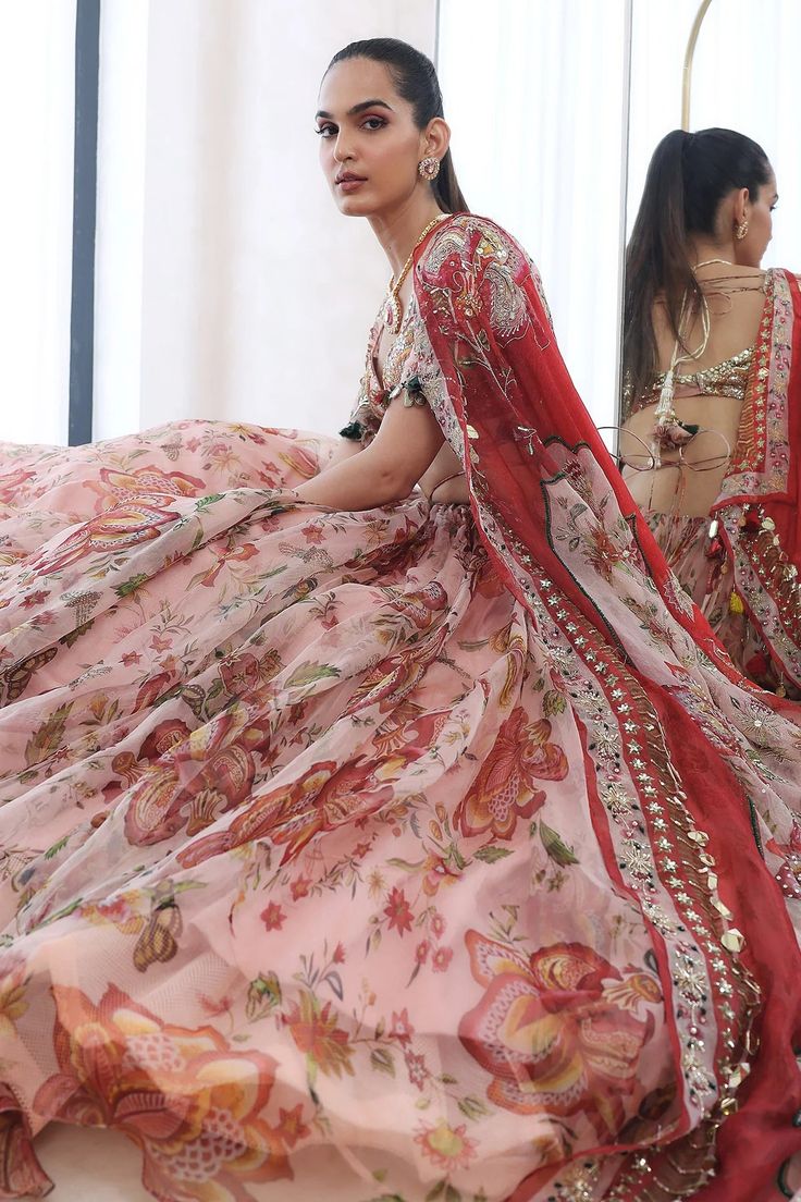 Embroidered Blouse With Lehenga And Dupatta. From Mahima Mahajan's Fida collection. DELIVERY TIMEPlease allow 6-8 weeks for your outfit to arrive. FABRIC DETAILSOrganza Professional cleaning only. Transitional Georgette Lehenga With Floral Embroidery, Floral Embroidered Sharara For Wedding And Navratri, Floral Embroidered Sharara For Wedding Navratri, Pink Dupatta With Intricate Embroidery For Ceremony, Organza Sharara With Dupatta For Ceremony, Unstitched Embroidered Traditional Wear For Ceremony, Pink Sharara With Dupatta For Ceremony, Pink Sharara With Resham Embroidery For Ceremony, Bollywood Style Organza Sharara For Ceremony