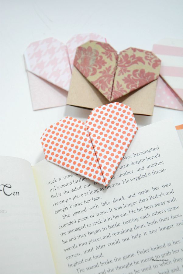 folded paper hearts sitting on top of an open book