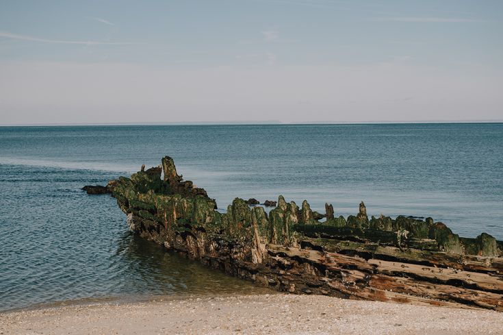 an old ship wreck in the middle of the ocean