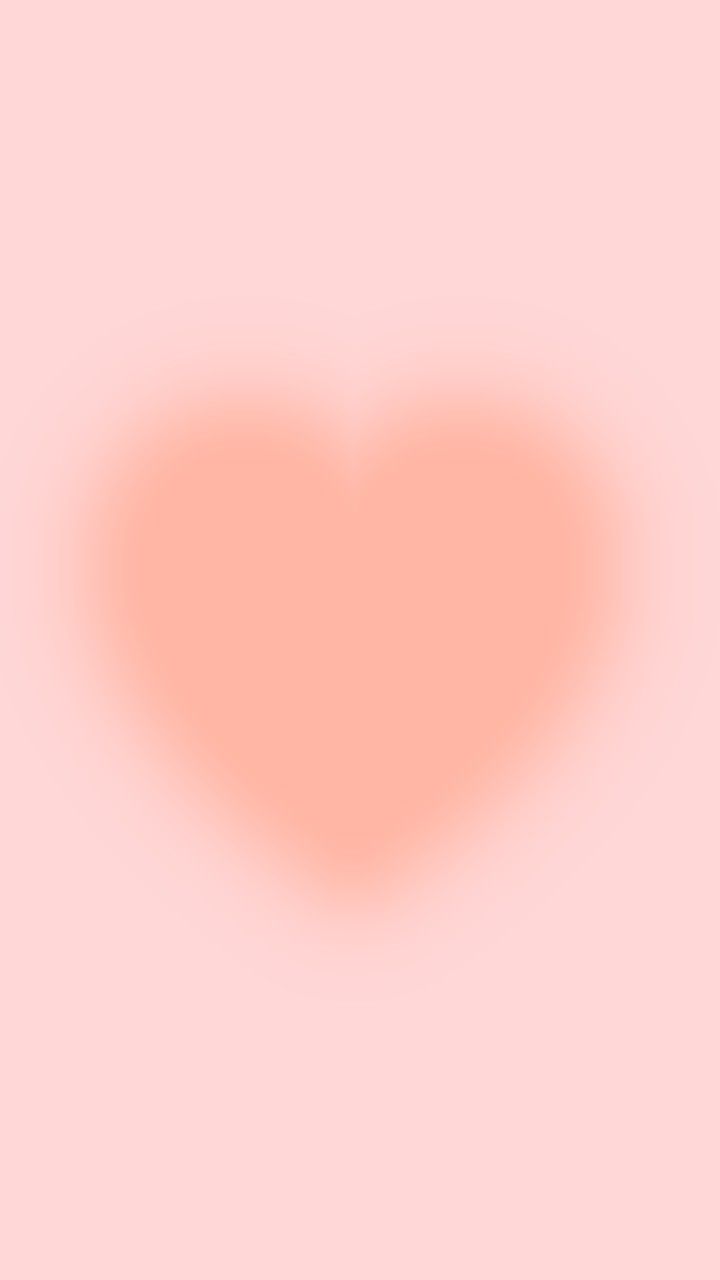 a heart shaped object on a pink background