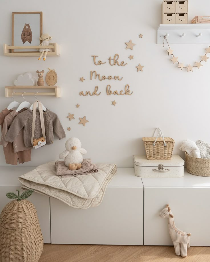 a baby's room with white walls and gold stars on the wall above it