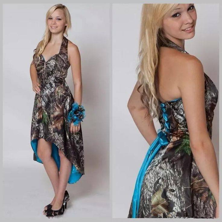 the woman is wearing a camo dress with blue sash around her waist and high heels