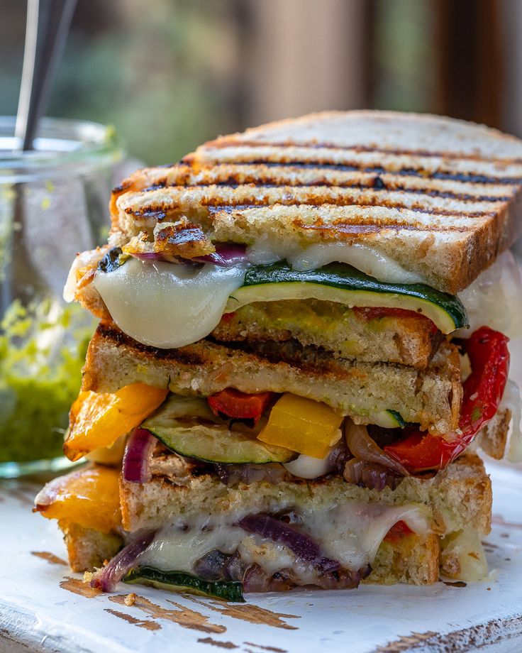 a grilled sandwich with vegetables and cheese