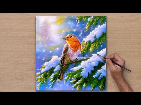 someone is painting a bird on a snowy tree branch with watercolors and pencils