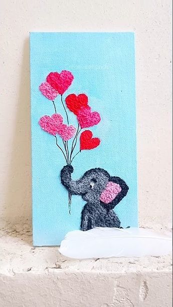 an elephant is holding some hearts on a blue background with red and pink balloons attached to it