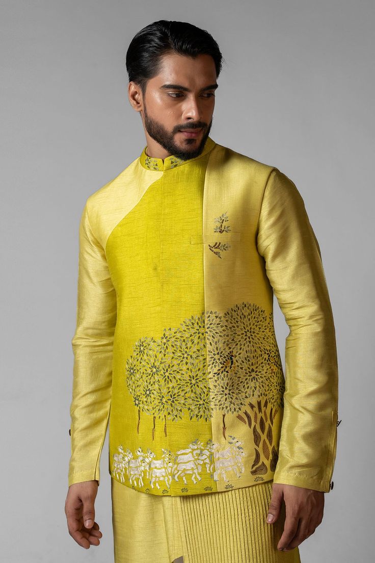 A wagle green and saple yellow colorblocked neheru jacket beautifully embroidered with a scene of Govardhan using resham dhagas and highlighted with pani chid. The jacket is paired with an assymetric pintucked kurta.

Size Chart For Men





	
	
					Men's Size Chart
		

		
		
						
				Size Chart For Men
				Custom Size Measurement Guide
			
			
				
				
				Custom Size Measurement Guide
1. Take your measurements at ease…don’t hold your breath!
2. Be a little generous with the measurements. I Lehenga Suit, Nehru Jacket, Nehru Jackets, Jacket For Men, Pants Pattern, White Pants, Aza Fashion, Skirt Length, Matching Sets