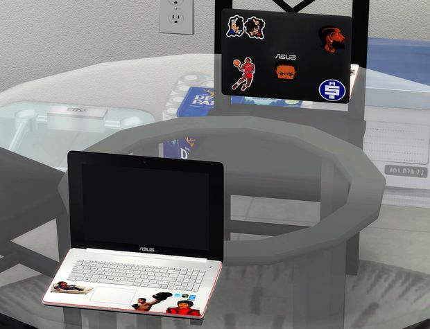 an open laptop computer sitting on top of a glass table next to a mouse pad