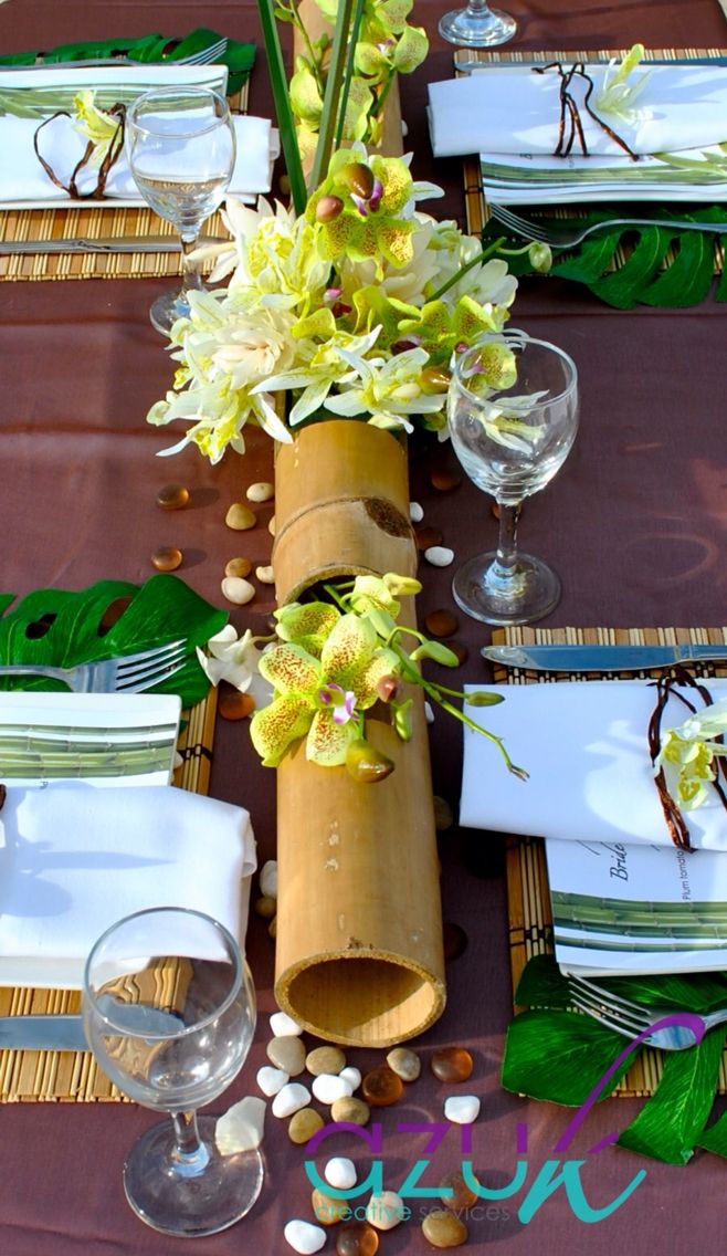 the table is set with flowers and place settings