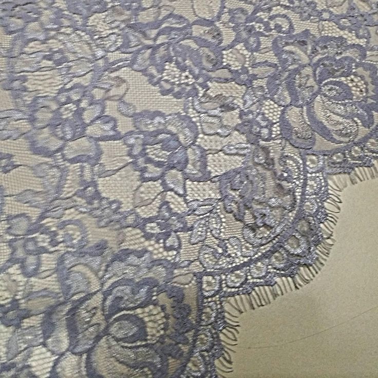 an image of lace on the back of a dress with flowers and leaves in it