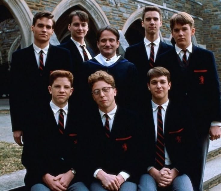 a group of young men wearing suits and ties