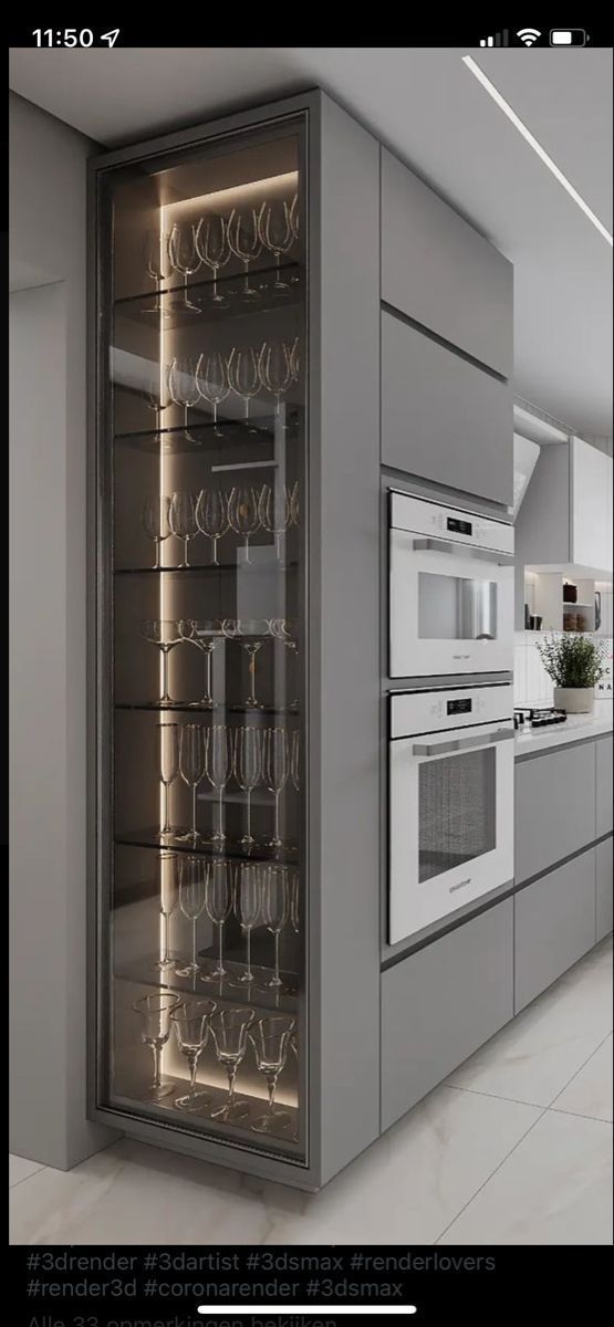 an image of a modern kitchen setting with wine glasses on the glass door and stainless steel appliances