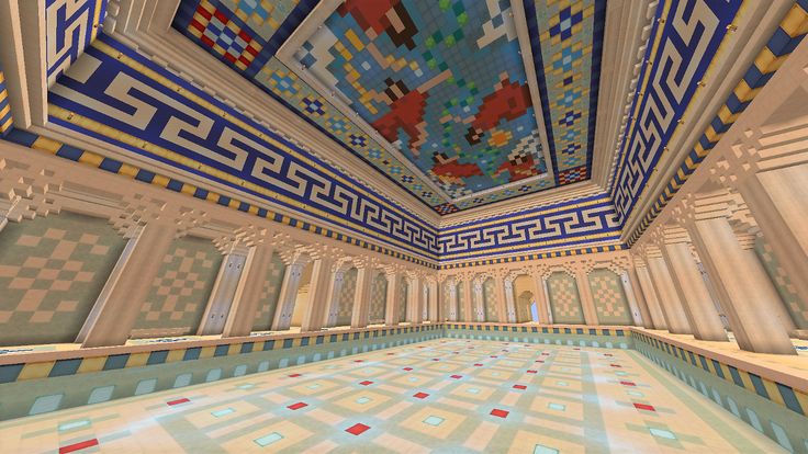 the inside of a building with tiled floors and walls, painted in bright blue and white colors