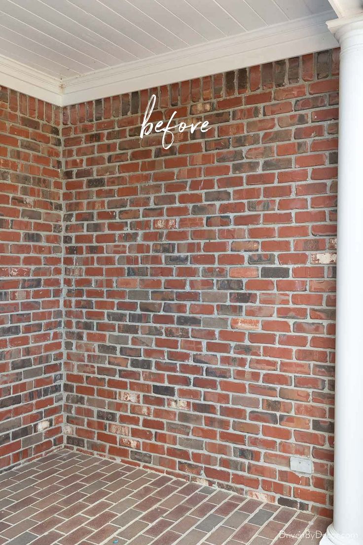 a brick wall with the words before painted on it in front of an empty room