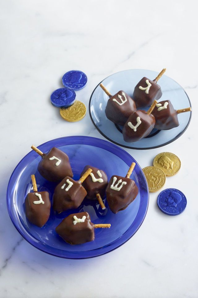 chocolate candies on a blue plate with gold coins