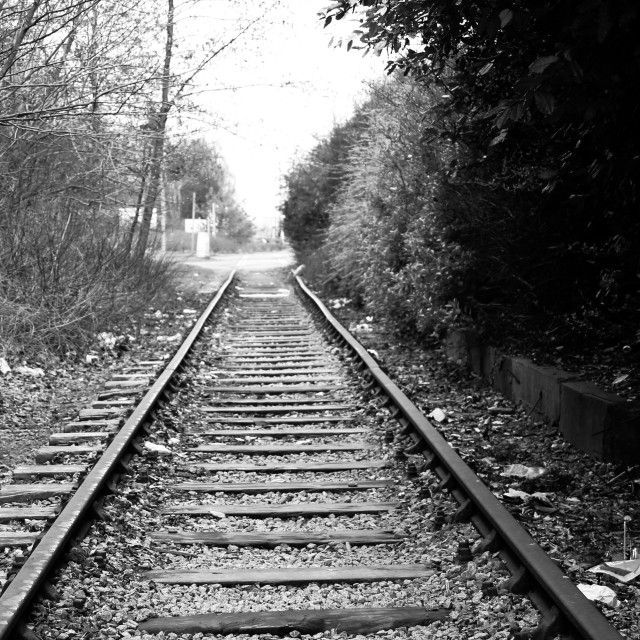 black and white photograph of an old train track