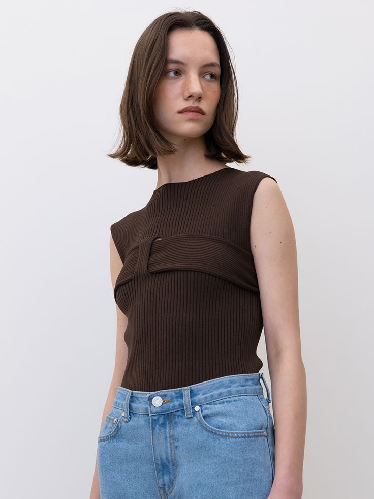 Editor's noteSensual knittop that made of solid ribbed fabric. Featuring its unique design with the asymmetricalhole detail of the chest and the short length. You can style with various kindsof bottoms like slacks, denim jeans, or skirts to complete the look in summer. - Standardsilhouette- Ribbedpattern- Hole detail atthe front- Both sensualand unique mood Measurements(in.)SIZE (34/36)- Shoulder: 12.79in / 13.58 in- Chest: 12.2in / 13.38 in- Hem: 12.2 in/ 13.38 in- Armhole: 6.69in / 7 Chic Brown Ribbed Knit Top, Chic Brown Knit Tank Top, Fitted Sleeveless Brown Knit Top, Chic Brown Sleeveless Knit Top, Chic Sleeveless Brown Knit Top, Sleeveless Knit Top, Sleeveless Knit, Other Outfits, Ribbed Fabric