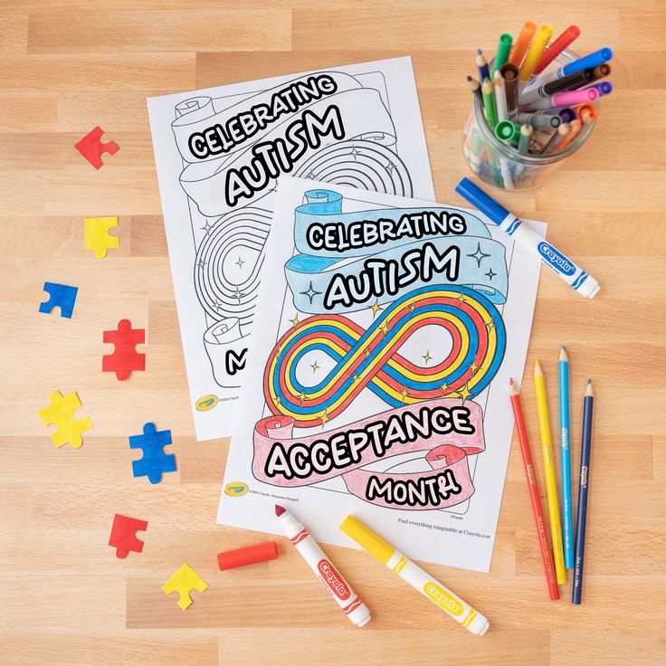 an adult coloring book on a wooden table with crayons and markers