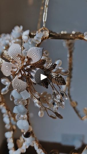 a bunch of beads hanging from the side of a chandelier