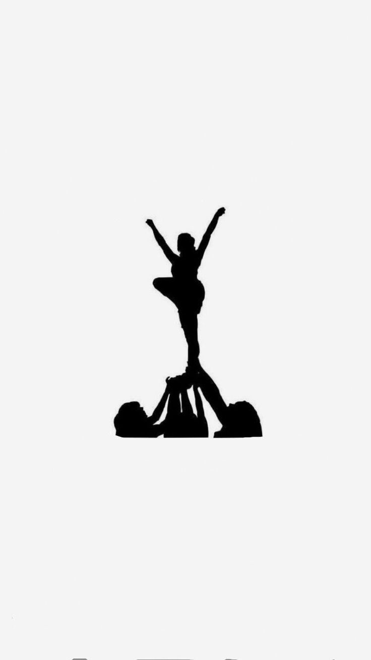 the silhouette of a person standing on top of another person's head with their arms in the air